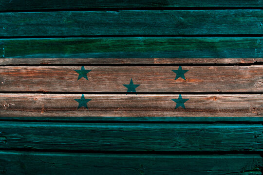3D Flag of Honduras on a old wood wall background.