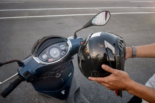 Man getting ready to drive his motorbike, close-up