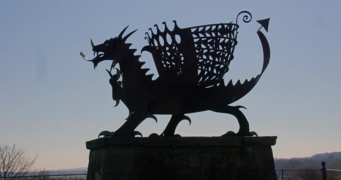 Wide zoom in Silhouette shot of the bagillt dragon beacon at the Bettisfield Colliery park.