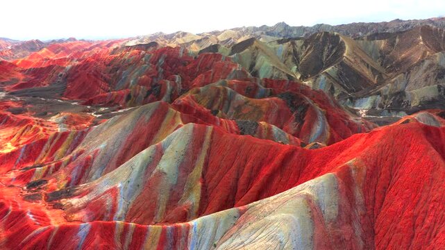 Aerial drone view of Zhangye Rainbow Mountains, vibrant multicolored Danxia landform in Gansu China
Drone shot of spectacular layered rainbow mountains, Zhangye Colorful Danxia geopark landscape