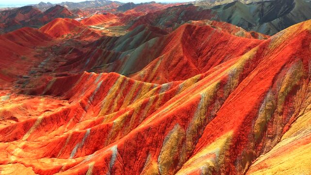Aerial drone view of Zhangye Rainbow Mountains, vibrant multicolored Danxia landform in Gansu China
Drone shot of spectacular layered rainbow mountains, Zhangye Colorful Danxia geopark landscape