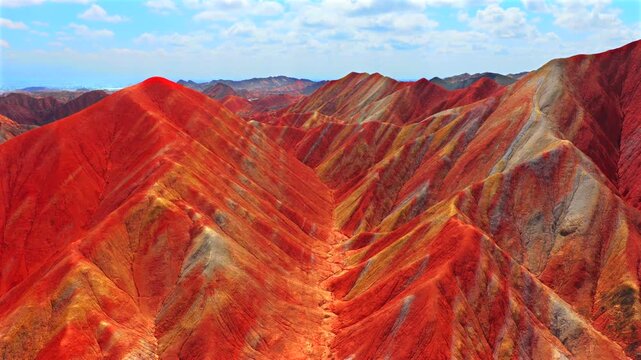 Aerial drone view of Zhangye Rainbow Mountains, vibrant multicolored Danxia landform in Gansu China
Drone shot of spectacular layered rainbow mountains, Zhangye Colorful Danxia geopark landscape