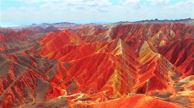 Aerial drone view of Zhangye Rainbow Mountains, vibrant multicolored Danxia landform in Gansu China
Drone shot of spectacular layered rainbow mountains, Zhangye Colorful Danxia geopark landscape