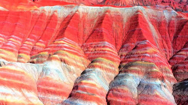 Aerial view of Zhangye Colorful Danxia landform, vibrant rainbow‑colored mountain strata in Gansu, China
Drone footage of Zhangye Qicai Danxia
