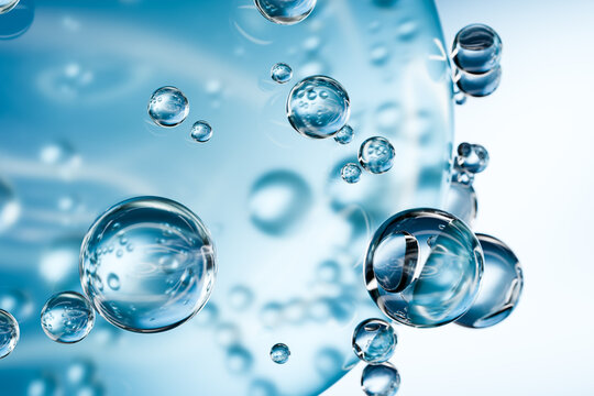 Abstract transparent blue bubbles with liquid, symbolizing hydration, skincare science, molecular research and biotechnology. Clean medical background for cosmetic and laboratory concepts	