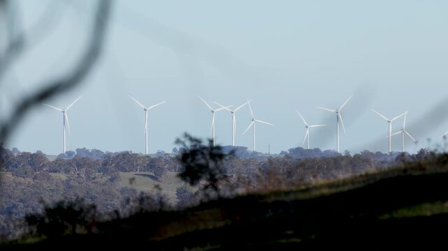 Wind Turbines Spinning on Rural Hills in New South Wales
