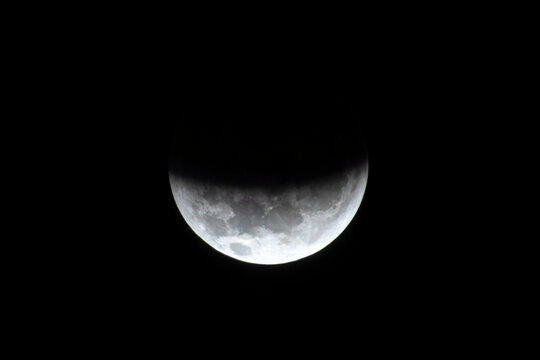 A close-up shot capturing the stunning partial lunar eclipse during the night of August 27 to 28, 2026, as seen from the southern hemisphere in Brazil. 