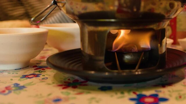 Close Up of Burning Fire Stove Under Thai Hot Pot