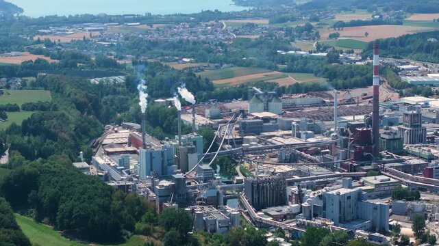 Expansive aerial view of the Lenzing Plastics industrial complex, highlighting its manufacturing facilities, pipelines, and smokestacks