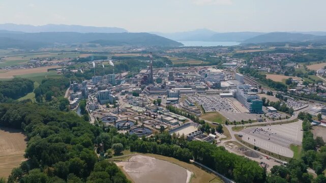 Vast industrial complex of Lenzing Plastics in Austria, showing the polymer production facilities, smokestacks, and wastewater treatment plant