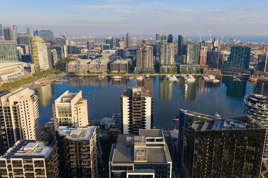 Aerial view of highrise buildings around a inner city river marina