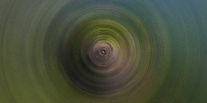 Abstract radial rotation vortex effect in muted dark green grey tones for sophisticated minimalist digital background.