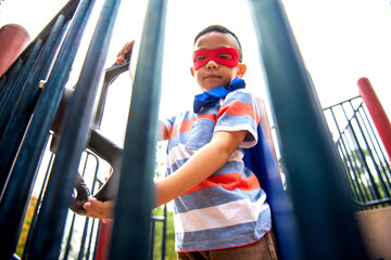 Child superhero on playground adventure. © Rawpixel.com