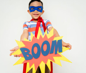 Child superhero holding boom sign. © Rawpixel.com