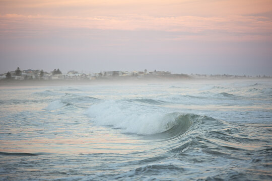 Serene Sea Fog Blanketing a Beachside Suburb at Dusk