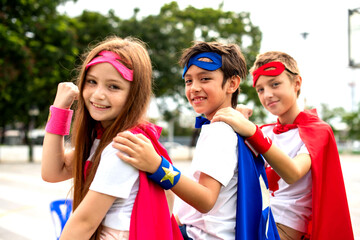 Children wearing superhero costumes outdoors. © Rawpixel.com