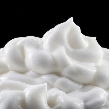 A dense, creamy, white lather creating thick peaks and soft mounds, suggesting purity, hygiene, and luxurious cleansing action ,detail ,treatment ,abstract