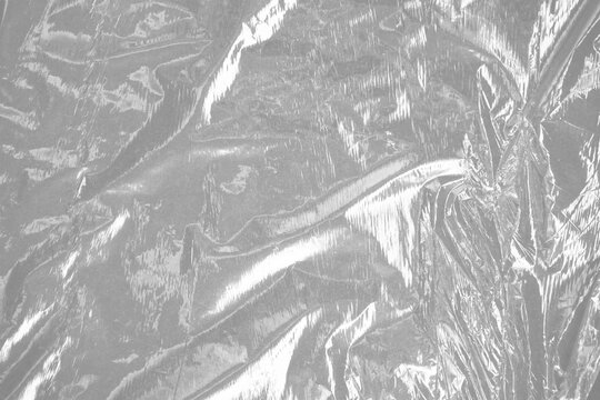 plastic wrap film wrinkled texture transparent reflective highlights isolated realistic packaging material shipping storage protection