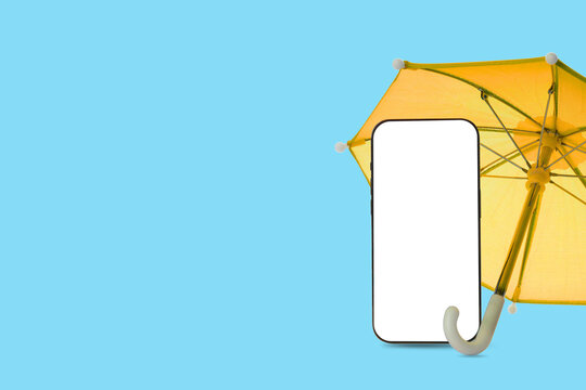 Insurance. Smartphone protected by vibrant yellow umbrella on blue background