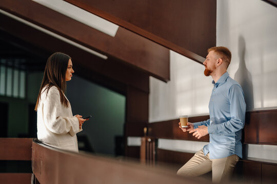 Business colleagues having a casual coffee break conversation