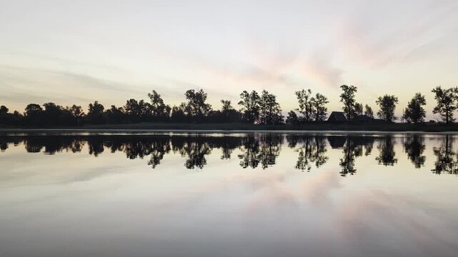 reflection of the calm lake on the background of a beautiful landscape in a sunset