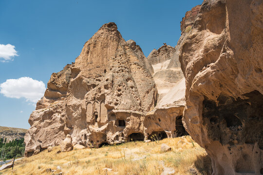 Rock-cut Selime Cathedral facade among volcanic cliffs in Aksaray, Turkey