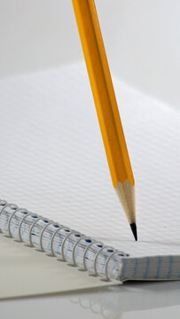 Pencil and notebook on a table ready for writing or drawing