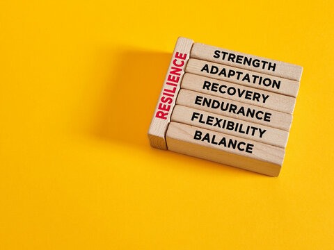 Resilience on wooden blocks showing strength and balance