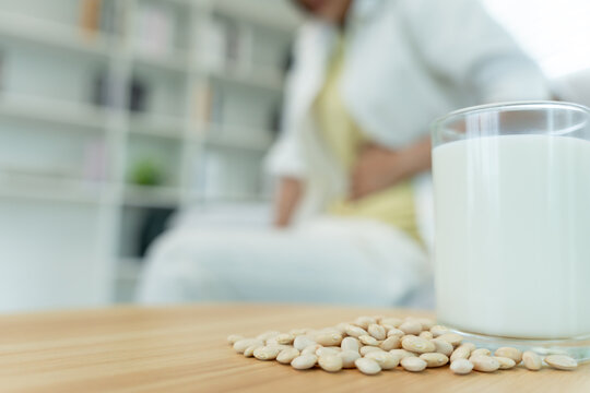 felling stomachache and diarrhea, soy allergens, Sick sad unhealthy ill allergic woman, r allergy trigger symptoms. abdominal pain, allergens, nut protein, rash, death, food allergy