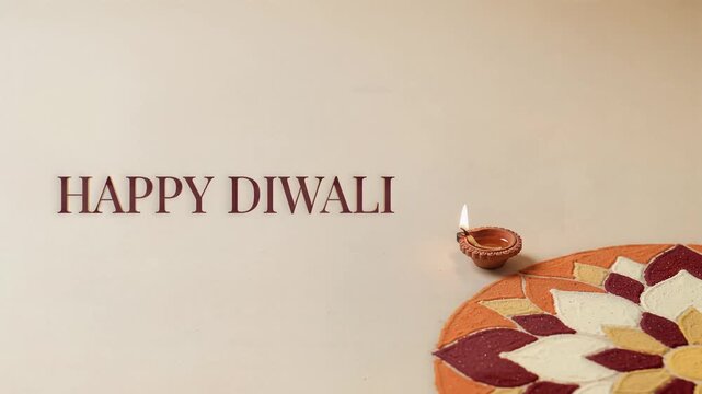 Happy diwali celebration with lit diya lamp and colorful rangoli pattern