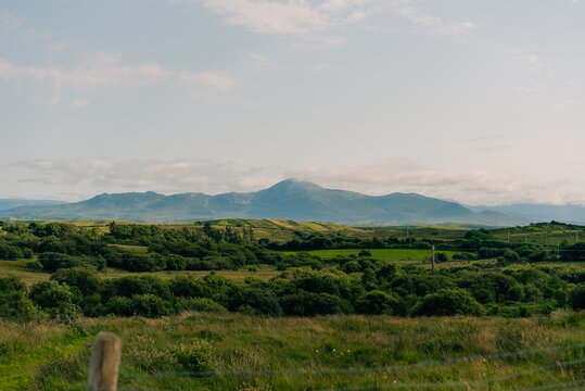 Scenic view of Clew Bay and the coastal village of Murrisk, surrounded by green hills and mountains along Ireland Wild Atlantic Way - County Mayo, Ireland - 31 August 2026.
