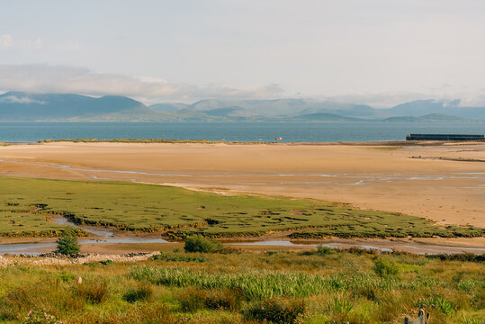 Scenic view of Clew Bay and the coastal village of Murrisk, surrounded by green hills and mountains along Ireland Wild Atlantic Way - County Mayo, Ireland - 31 August 2026.