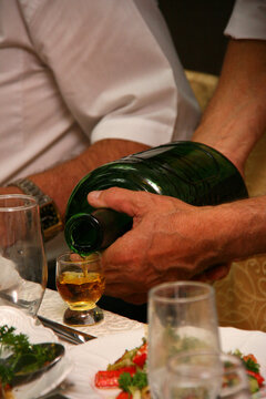 Man pouring alcohol into a shot