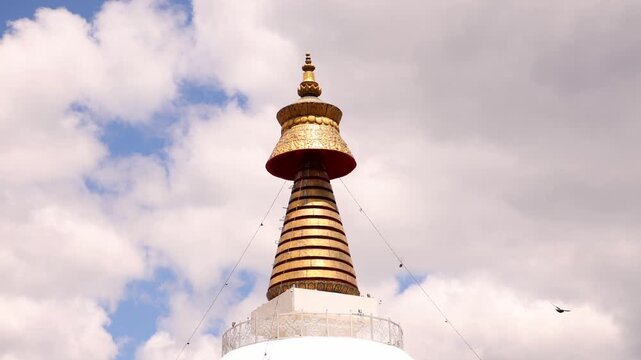 Close up ornate gold spire crowning a Buddhist stupa temple in Bhutan