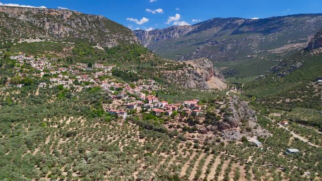 Picturesque amfissa village nestled in the elaionas olive grove with mountains in the background