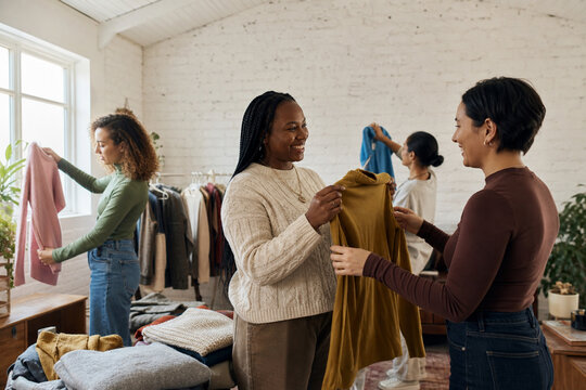 Friends hosting neighborhood clothing swap