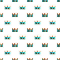 Naklejka premium Repeated cartoon castles creating a playful, seamless pattern for backgrounds