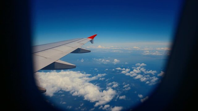 Relax and enjoy safety multi-hour flight in modern comfortable airplane, tourism . Business trip or summer travel in vacation, look on wing in porthole, fear of flying and anti-anxiety medication