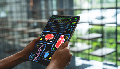 Person holding digital tablet displaying medical data, including heart rate, brain activity, and DNA analysis, in modern setting © Rawat