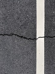 Fototapeta premium asphalt floor surface cracked for wallpaper background