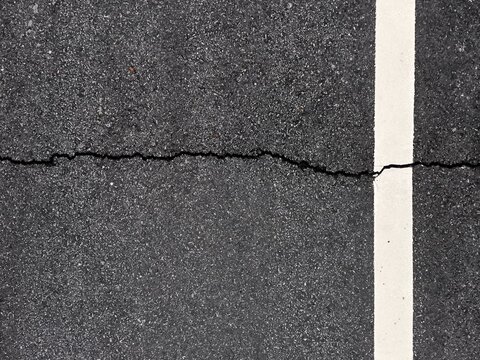 asphalt floor surface cracked on background