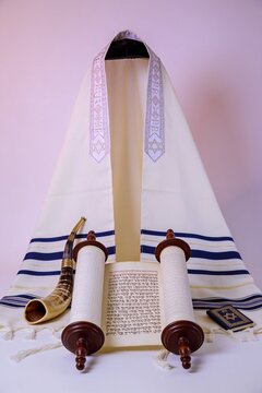 Open Torah scroll with Shofar horn and Tallit prayer shawl