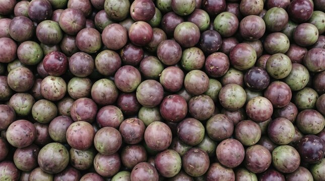 Extreme close up overhead photograph of fresh star apples arranged closely, perfect for healthy lifestyle blogs, grocery marketing, and food website backgrounds