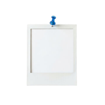 Blank polaroid photo frame attached to the wall with a blue push pin