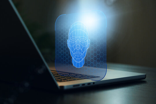 Deep fake technology shows a digital face model on a laptop screen in a dark room at night