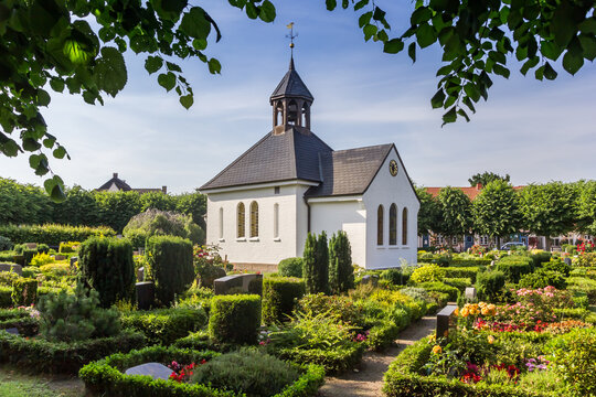  Little white chapel at the cemetary in Schleswig, Germany
