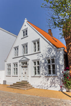 Old white house in historic town Tonder, Denmark