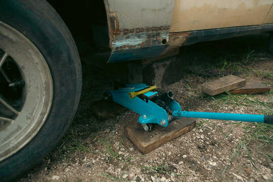 Repair of a broken car on the street.