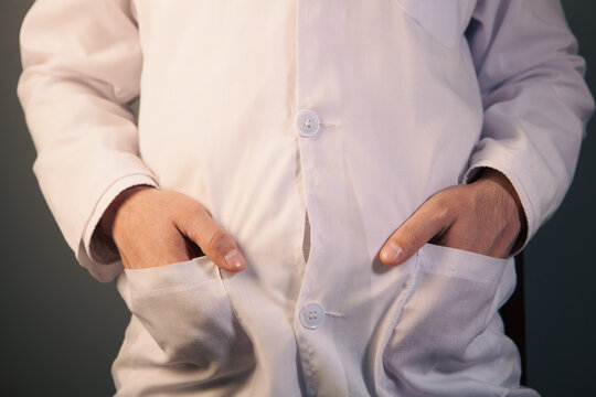 Close  doctor up of a man in a white shirt on a dark background