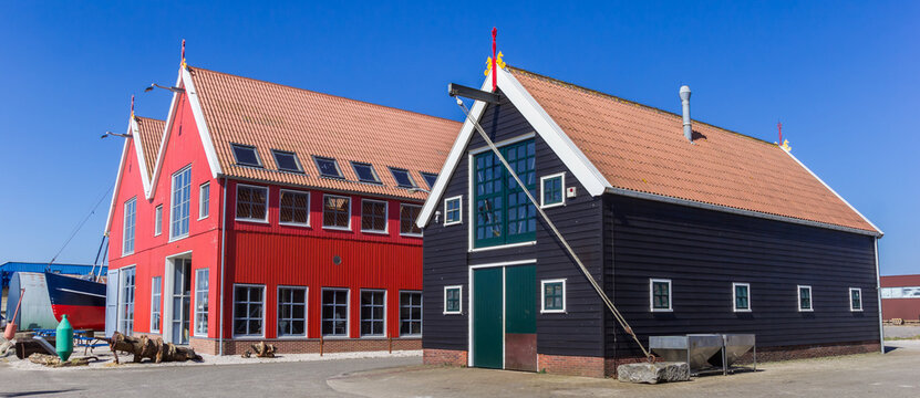 Panorama of wooden warehouses in the harbor of Zoutkamp, Netherlands